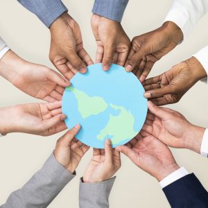 Hands holding earth CSR business campaign